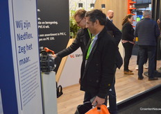 Visitors study what Van der Lande brought to the fair.